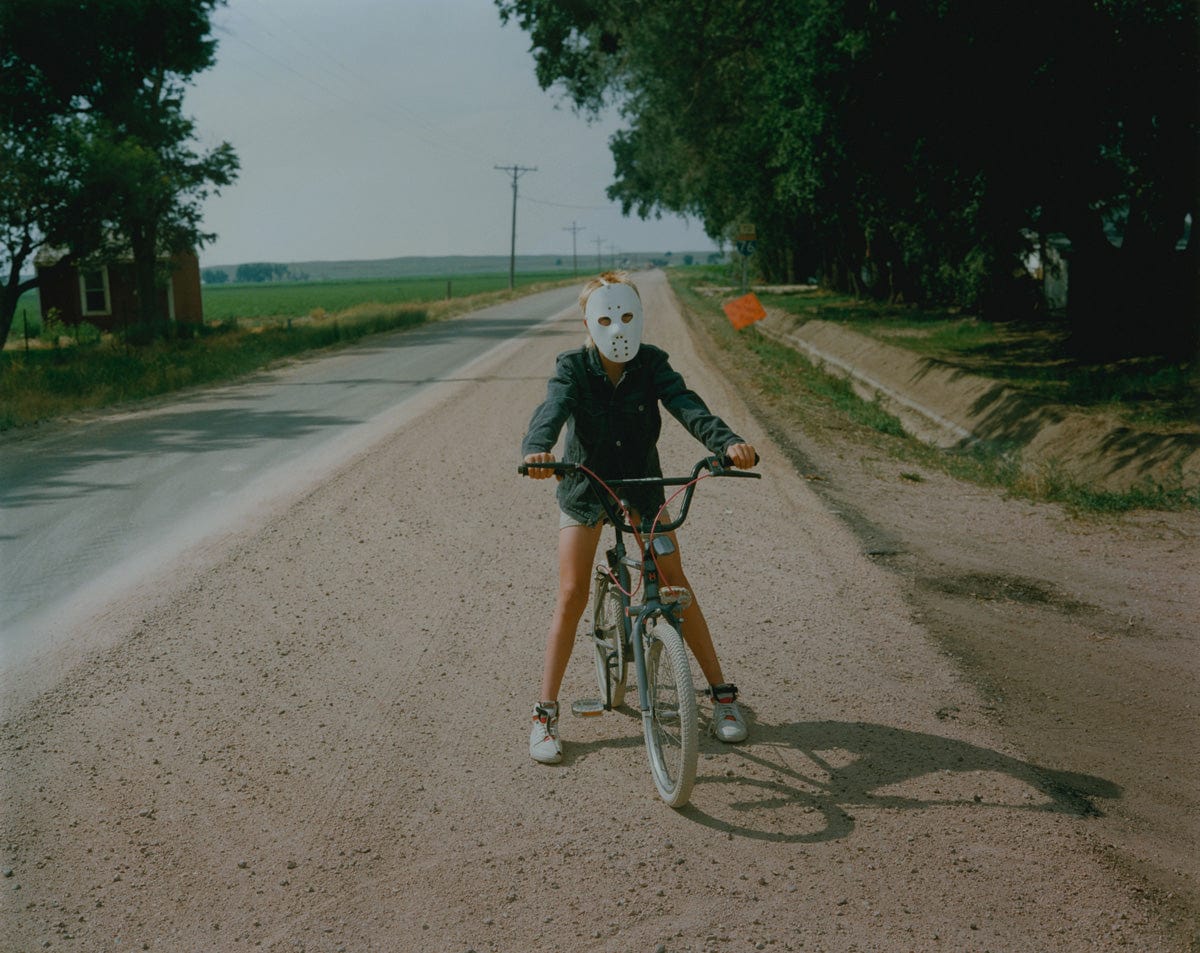 Crane Kalman Brighton Child with Mask, Hillrose, Colorado, 1989 Photograph